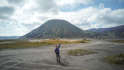 Lover couple are traveling to volcano at Mt.Bromo (Gunung Bromo) Kingkong hill East Java, Indonesia