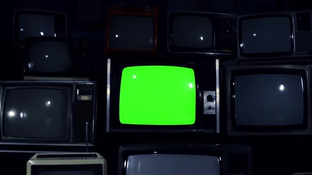 Old TV Green Screen Among Retro TVs. Dolly In. Night Tone. You can replace green screen with the footage or picture you want with &ldquo;Keying&rdquo; effect in AE  (check out tutorials on YouTube).