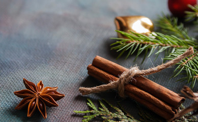 Happy Christmas. The concept of postcards, Christmas greetings, Christmas articles. Christmas cinnamon, tree branches, anise, cones. Close up. Selective focus. Copy space.