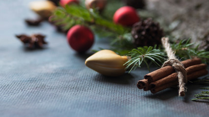 Happy Christmas. The concept of postcards, Christmas greetings, Christmas articles. Christmas cinnamon, tree branches, anise, cones. Close up. Selective focus. Copy space.