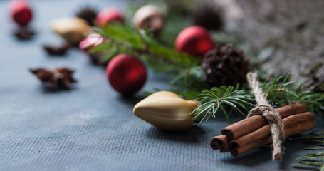 Happy Christmas. The concept of postcards, Christmas greetings, Christmas articles. Christmas cinnamon, tree branches, anise, cones. Close up. Selective focus. Copy space.