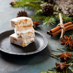 Happy Christmas. The concept of postcards, Christmas greetings, Christmas articles. Christmas sweets, cinnamon, tree branches, anise, cones. Close up. Selective focus.