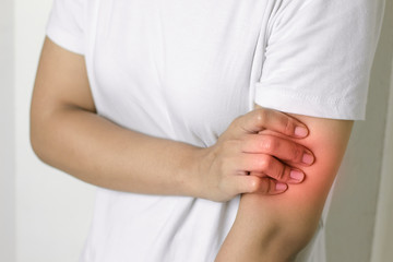 Woman with pain in arm.
