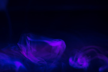 purple, blue, pink smoke (evaporation) on a black background