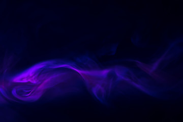 purple, blue, pink smoke (evaporation) on a black background