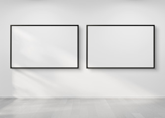 Two horizontal frames hanging on a wall mockup 3d rendering