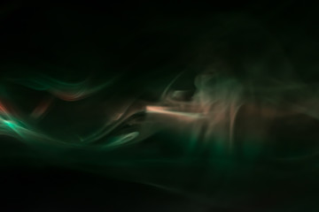 green, orange, white smoke (evaporation) on a black background