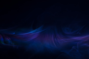 purple, blue, pink smoke (evaporation) on a black background