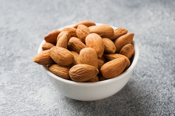 Almonds in a bowl. Selective focus Close up