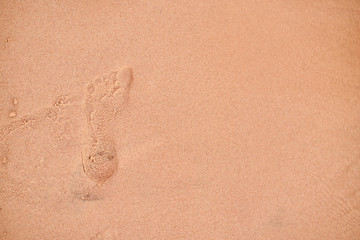 human footprints in the sand