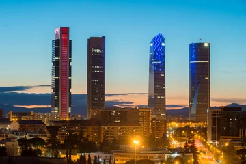  Madrid Four Towers financial district skyline at twilight in Madrid, Spain. © ake1150