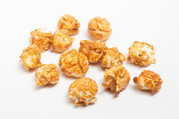 Caramel popcorn on white background.