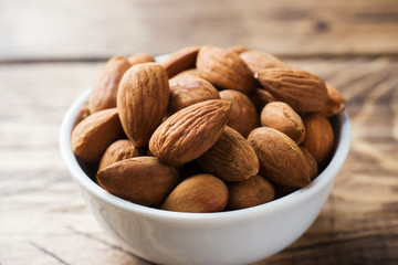 Almonds in a bowl. Selective focus Close up