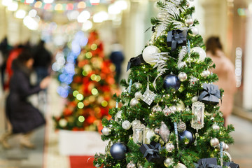 Image of decorated Christmas spruce in store .
