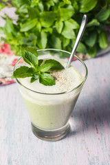 Green detox smoothie with avocado, herbs and yogurt