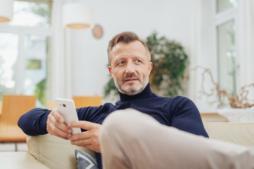 Trendy bearded man with a speculative expression