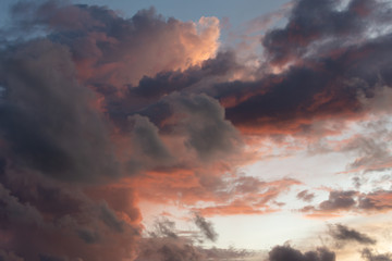 Magnificent colored clouds on the sea at sunset in the evening