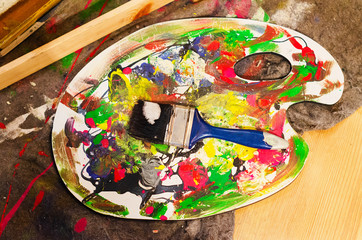 paint and brush palette in the artist's studio