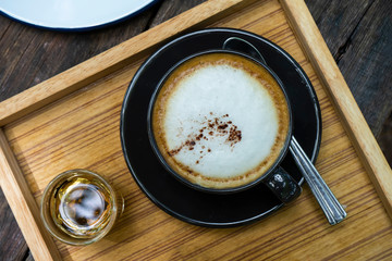 Close up coffee cup on wooden.