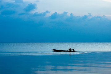 Fototapeta na wymiar Silhouette of minimal fishing boat