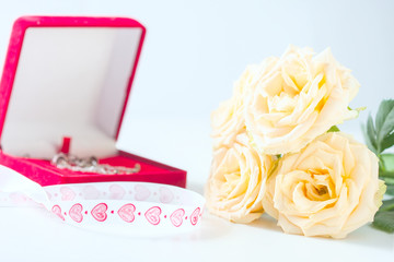 yellow roses and box packaging for jewelry.