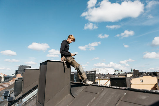 Roofer on a work break in Stockholm, Sweden