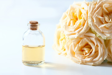 Glass jar with rose water and aromatherapy, copy space for text.