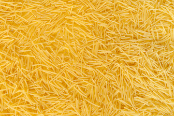 Macaroni and vermicelli scattered as a background