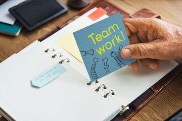 Teamwork written on a  sticky note