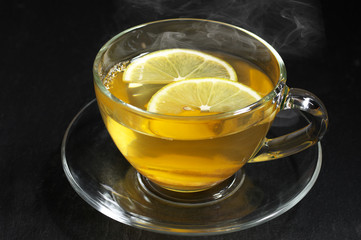 Ginger tea with lemon in glass cup