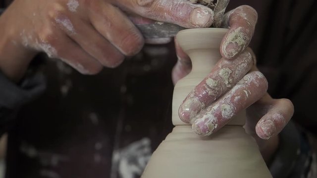 Ceramicist makes minature Tagines in a ceramics factory in Fez, Morocco.