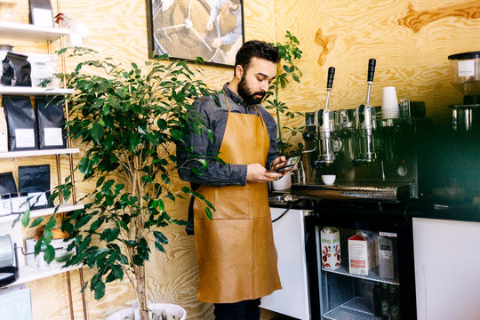 Small business owner in his coffee roaster shop