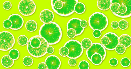 Background with green, fresh lemons on a lime color background - 236246223