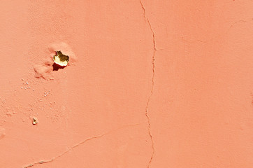 Texture of cracked wall. Old terracotta painted background. Banner with cracks, scrapes, peeling, holes