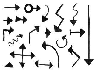 Black brush and ink artistic rough hand drawing of set of arrows.