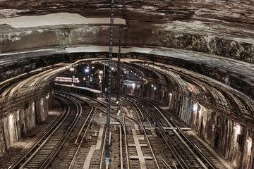 Fototapeta na wymiar View on a tunnel with railroads in Paris underground.