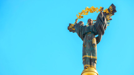 Monument of Independence of Ukraine in front of blue sky. The monument is located in the center of Kiev on Independence Square. Baroque and Empire.