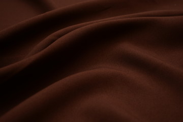 Texture of dark brown fabric closeup. Low key photo. Plexus threads. Clothing industry. Abstract...