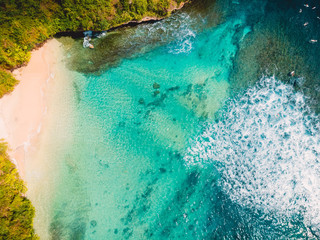 Aerial view of tropical beach with crystal turquoise ocean water