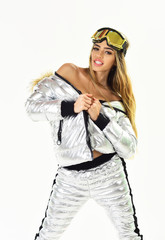 Cheerful and positive. Holyday atmosphere. Happy winter holidays. Winter sport and activity. Girl in ski or snowboard wear. Sexy woman in winter clothes. Ski resort and snowboarding