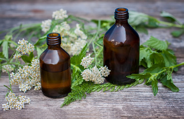 Bottles with organic oil  on  wooden background.