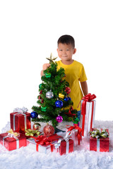 Happy asian child holding gold star for decoration Christmas tree. Christmas or happy newyear time