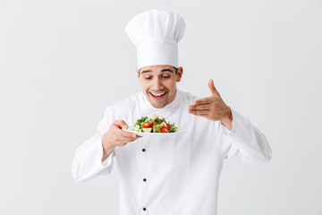 Excited man chef cook wearing uniform
