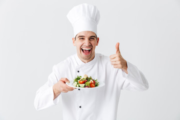 Excited man chef cook wearing uniform
