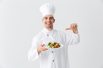 Excited man chef cook wearing uniform