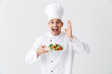 Excited man chef cook wearing uniform