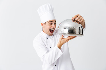 Excited man chef cook wearing uniform