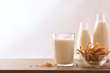 Spelled drink in containers with white background