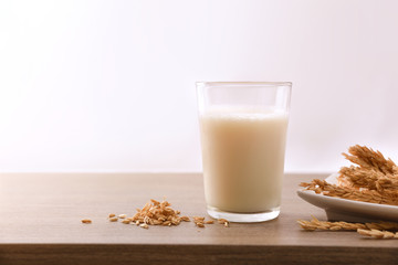 Spelled drink in containers with white background