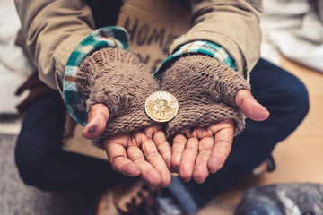 Hand palm homeless dirty with receive donation a gold bitcoin